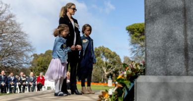 Major Angela Uphill and her two children lay a wreath during the 2024 Legacy Week launch at the Australian War Memorial, Canberra. Story by Corporal Luke Bellman. Photo by Leading Seaman Nadav Harel.