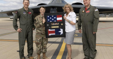 (L-R) Lieutenant Colonol Justin Meyer, Master Sergeant Emily Luzum, Debbie Wadwell and Group Captain Paul Jarvis with a shadow box for the Russell family, at RAAF Base Amberley, Qld. Story by Flight Lieutenant Rob Hodgson. Photos by Corporal Brett Sherriff.