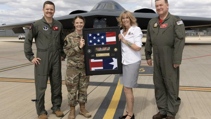 (L-R) Lieutenant Colonol Justin Meyer, Master Sergeant Emily Luzum, Debbie Wadwell and Group Captain Paul Jarvis with a shadow box for the Russell family, at RAAF Base Amberley, Qld. Story by Flight Lieutenant Rob Hodgson. Photos by Corporal Brett Sherriff.