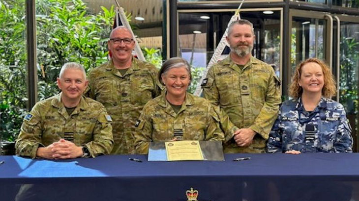 Group Captain Gary Sadler, Warrant Officer Jason Pyke, Group Captain Kylie Green, Warrant Officer Korey McGregor and Wing Commander Fiona Pearce following the 17 Squadron handover/takeover ceremony. Story by Scott Jenner.