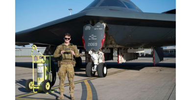 Leading Aircraftman Blake O'Brien stands in front of a US Air Force B-2 Spirit Stealth Bomber on the RAAF Base Amberley flight line. Story by Flight Lieutenant Rob Hodgson. Photo by US Air Force