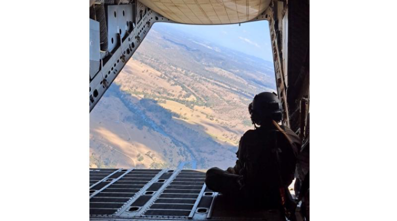 Air Force C-27J Spartan loadmaster Corporal Deniele Oehm enjoys the view on the ramp of a C-27J Spartan during a flight. Story by Flight Lieutenant Imogen Lunny.