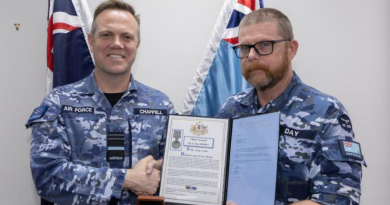 Flight Sergeant Barry Day from Heavy Air Lift Systems Program Office is presented his fifth clasp to his long service medal by Chief of Air Force Air Marshal Stephen Chappell. Story by Flight Lieutenant Nicole Thomson-Pride. Photo by Aircraftman Campbell Latch.