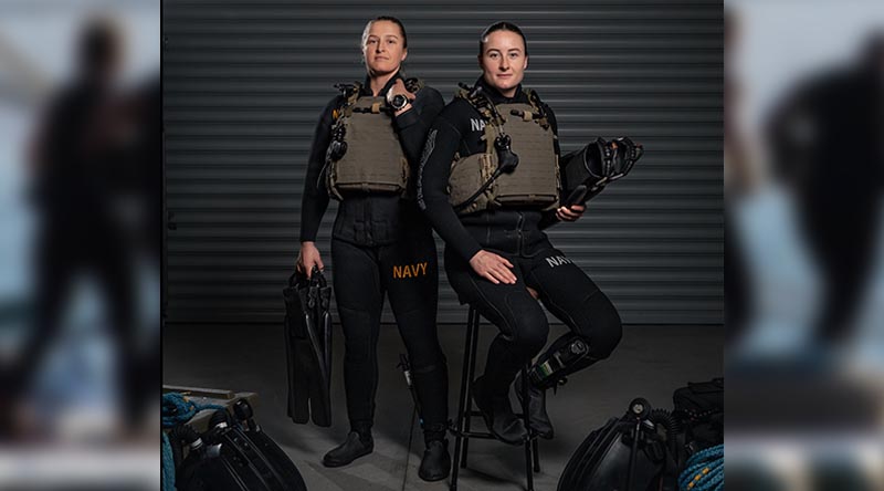 Able Diver Petra Dye-Hutchinson and Lieutenant Bethany Ward in their dive gear at the Devonport Naval Base dive section. Bethany and Petra are the first females to complete the Navy dive course. NZDF photo.