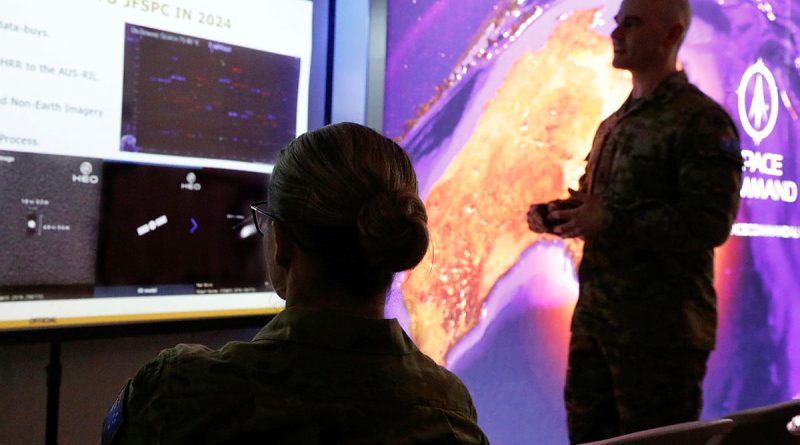 Army's Major Thomas Bittner briefs ADF Chief of Joint Capabilities Lieutenant General Susan Coyle in the Air Force Space Command Operations Centre during Exercise Pitch Black this year. Story by Ricky Bryan. Photo by Sergeant Andrew Eddie.