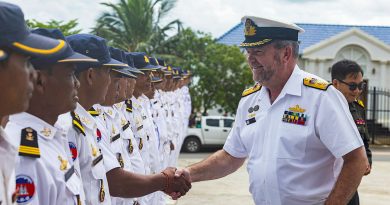 Commander IPE24 Commodore Michael Harris greets officials from the Royal Cambodian Armed Forces at the Ream Naval Base during HMAS Perth's visit to Sihanoukville, Cambodia. Story by Lieutenant Commander Natalie Stafford. Photos by Leading Seaman Ernesto Sanchez.