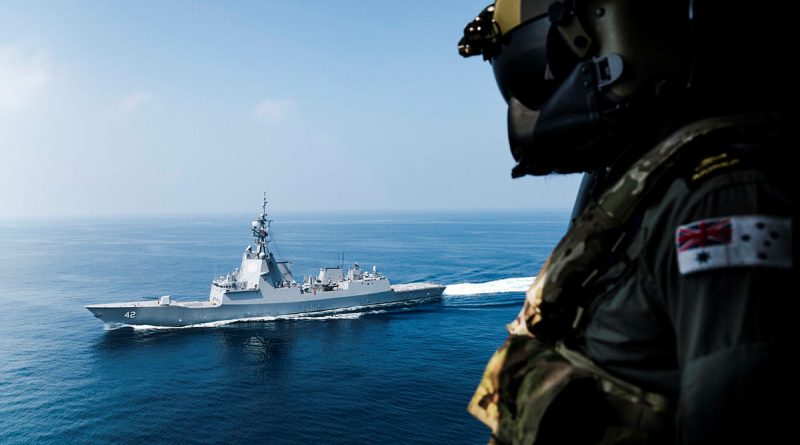 Leading Seaman James Neville looks out towards HMAS Sydney as the ship is deployed on Operation Argos. Story by Lieutenant Tahlia Merigan. Photos by Leading Seaman Daniel Goodman.