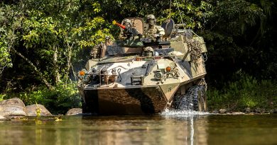 An Army light armoured vehicle from 2nd Cavalry Regiment crosses a river during Exercise Regional Warfighter at Tully Training Area, Queensland. Story by Lieutenant Eddie Pa’ak (Papua New Guinea Defence Force). Photos by Corporal Jack Pearce.