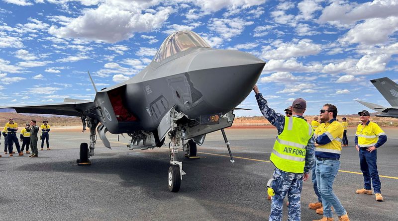 Aircraftman Nicholas Thorpe, of 25 Squadron, and Squadron Leader James Wheeler, of 3 Squadron, speak with Eliwana mine staff during a visit to Eliwana airport in the Pilbara region of WA. Story and photos by Stephanie Hallen.