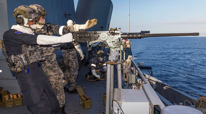 Japan Maritime Self-Defense Force's Rear Admiral Kazushi Yokota, Commander, Escort Flotilla 3, fires the .50 calibre machine gun on board HMAS Warramunga during Exercise Kakadu 24. Story by Lieutenant Marie Davies. Photo by Leading Seaman Iggy Roberts.