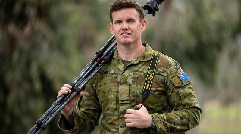 Private Jack Hayes prepares for a photography task at the Army Logistic Training Centre at Latchford Barracks, Bonegilla, Victoria. Story by Major Evita Ryan. Photo by Private Joseph Hess.