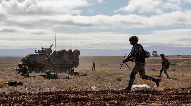 Australian and Malaysian Army soldiers conduct dry-fire rehearsals during Exercise Southern Tiger at Cultana Field Training Area, South Australia. Story by Captain Peter March. Photo by Corporal Cameron Pegg.