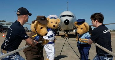 The Legacy bears pose with 24 Squadron team members prior to the P-8A aircraft pull at RAAF Base Edinburgh, South Australia. Story by Flight Lieutenant Robert Cochran. Photo by Sergeant Nicci Freeman.