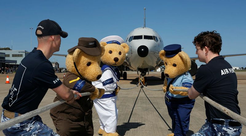 The Legacy bears pose with 24 Squadron team members prior to the P-8A aircraft pull at RAAF Base Edinburgh, South Australia. Story by Flight Lieutenant Robert Cochran. Photo by Sergeant Nicci Freeman.