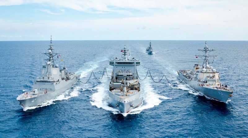 Japan Maritime Self-Defense Force's JS Sazanami sails behind Royal New Zealand Navy's HMNZS Aotearoa, centre, while conducting a dual replenishment at sea with HMAS Sydney, left, and USS Howard, right, in the South China Sea. Story by Lieutenant Tahlia Merigan. Photos by LS Daniel Goodman.