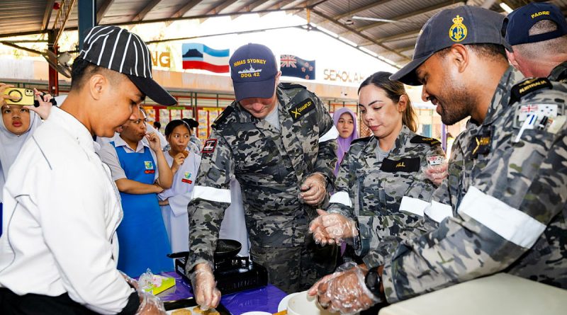 From left, Able Seaman Ben Champley, Leading Seaman Joanne Hill and Leading Seaman Rocky Ahwang help to make Anzac biscuits during a visit to Sekolah Menengah Kebangsaan SANZAC school in Kota Kinabalu, Malaysia. Story by Lieutenant Tahlia Merigan. Photos by Leading Seaman Daniel Goodman.