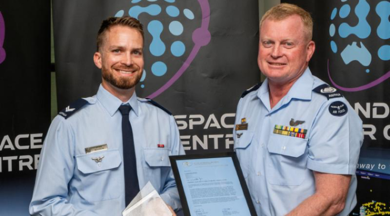 Corporal Ryan Hodson, left, receives The Corporal Margaret Clarke Award from Warrant Officer of the Air Force Ralph Clifton at an awards ceremony held at Russell Offices, ACT. Photo by Flight Sergeant Kev Berriman.