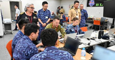 Commander Information Warfare Force Captain Catherine Gordon observes team 3 with Leading Aircraftman Shumack. Story by Lieutenant Commander Julian Thirkill.