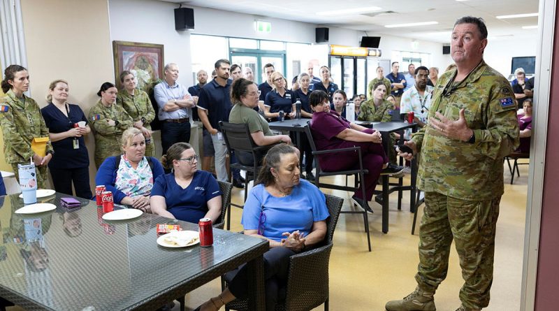 Lieutenant Colonel Stephen Jenkins, staff officer at Headquarters 1st (Australian) Division, thanks staff at the Enoggera Health Centre, Gallipoli Barracks, Brisbane, after his recovery from cancer. Story and photos by Captain Peter Nugent.