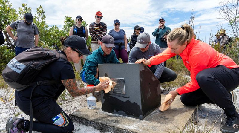 Members of Air Combat Electronic Attack Systems Program Office clean the memorial site for the lost aircrew of a downed F-111C during a team-building activity at Bundjalung National Park, Queensland. Story by Pilot Officer Timothy Sullivan. Photo by Leading Aircraftwoman Campbell Latch.