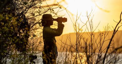 Private Leonard Harris, of NORFORCE, uses a spotting scope to conduct surveillance of the northern Kimberley region of WA. Story by Captain Katy Manning. Photo by Corporal Michael Currie.