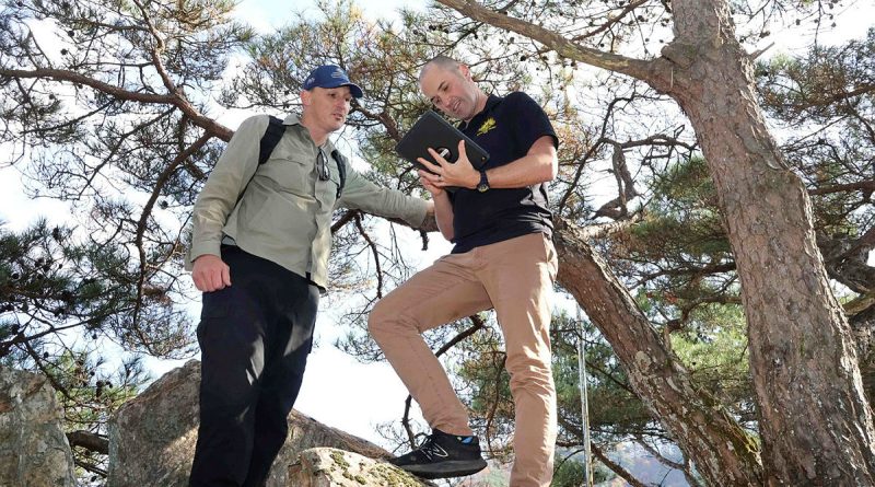 Adam Bourke, left, and Major Dan Nailer fix their position during a reconnaissance of the Kapyong battlefield in the Republic of Korea. Story and photos by Lieutenant Commander Brendan Trembath.