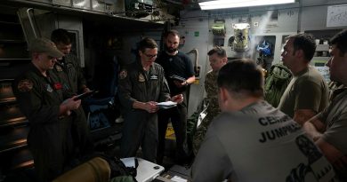 Flight Lieutenant Tom Breadon, of RAAF’s 36 Squadron, briefs mission details before a joint air-drop mission over Alaska. Story by Flight Lieutenant Nicole Thomson-Pride. Photos by Senior Airman Mark Sulaica (US Air Force).