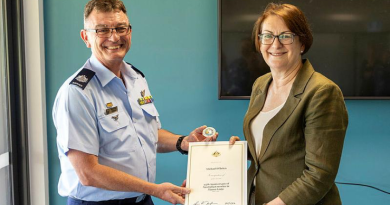 Warrant Officer Michael O'Brien is awarded a 25th Anniversary Commemorative Coin by Susan Templeman, the Federal member for Macquarie, for Australia’s participation in The International Force East Timor, at the Windsor and District Returned Services League Sub-Branch, NSW. Story by Flying Officer Madeleine Magee. Photo by Aircraftwoman Mikaela Fernlund.