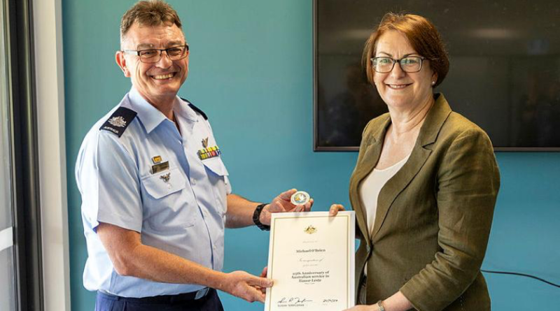 Warrant Officer Michael O'Brien is awarded a 25th Anniversary Commemorative Coin by Susan Templeman, the Federal member for Macquarie, for Australia’s participation in The International Force East Timor, at the Windsor and District Returned Services League Sub-Branch, NSW. Story by Flying Officer Madeleine Magee. Photo by Aircraftwoman Mikaela Fernlund.