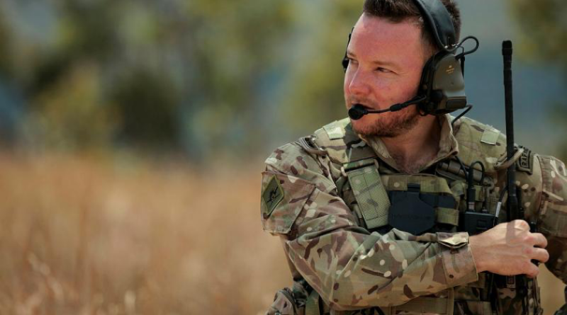 Royal Air Force Joint Terminal Attack Controller Sergeant Craig Clarke changes his radio's frequency during live-fire serials as part of Exercise Black Dagger 2024. Story by Flight Lieutenant Grace Casey-Maughan. Photo by Aircraftwoman Laura Flower.