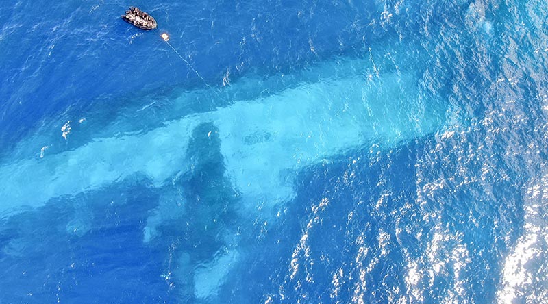 RNZN Divers survey the area around HMNZS Manawanui on the southern coast of Upulo as part of Op Resolution – NZDF's recovery/salvage operation. Image supplied.