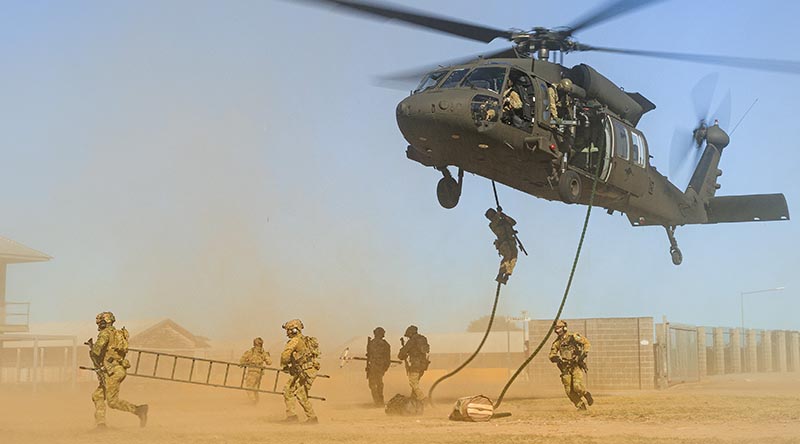 Australian Army soldiers and aviators conduct helicopter insertion and extraction training as part of UH-60M Black Hawk introduction-into-service activities. Photo by Corporal Robert Whitmore.