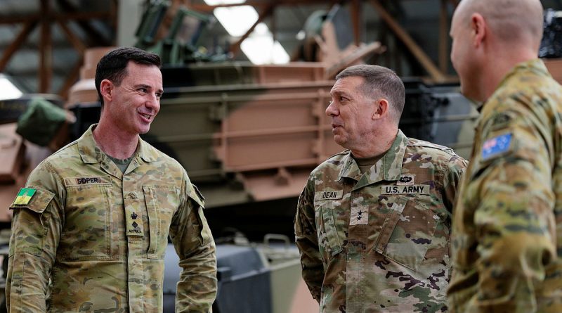 US Army Major General Glenn Dean, centre, speaks with Commanding Officer Army School of Electrical and Mechanical Engineering Lieutenant Colonel Tim Soper, left, during the Abrams M1A2 main battle tank maintainer course at Gaza Ridge Barracks, Bandiana, Victoria. Story by Captain Krysten Clifton. Photos: bySergeant Andrew Sleeman.