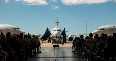 Attendees of a memorial service for the late Wing Commander Peter Krieg with a static display of E-7A Wedgetail aircraft at 2 Squadron, RAAF Base Williamtown. Story by Flight Lieutenant Grace Casey-Maughan. Photos by Aircraftwoman Laura Flower.