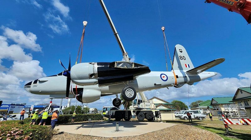 Two cranes return Neptune A89-280 back onto its plinth at the RAAF Base Townsville entrance. Story by Flight Lieutenant Julia Ravell.