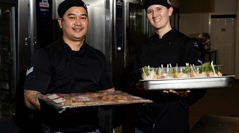 Air Force chefs Corporal Raymund Wrobel, left, and Leading Aircraftwoman Rebecca Lowry wear the newly issued food handlers short and long-sleeve coats at RAAF Base Amberley. Story by Bruce Chalmers. Photo by Aircraftman Nell Bradbury.