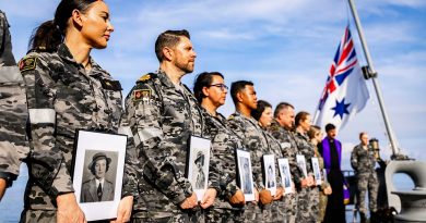 Nursing officers at the Bangka Island Massacre memorial service on board HMAS Adelaide hold photos of those who lost their lives in 1942. Story by Commander Steven Grosser. Photos by Leading Seaman David Cox.