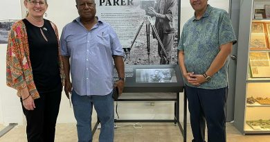 Ambassador to the Republic of Palau Richelle Turner, left, with the Governor of Peleliu Emais Roberts and Republic of Palau President Surangel Whipps Jr, at an exhibition of the life of Damien Parer. Story by Lieutenant Geoff Long.