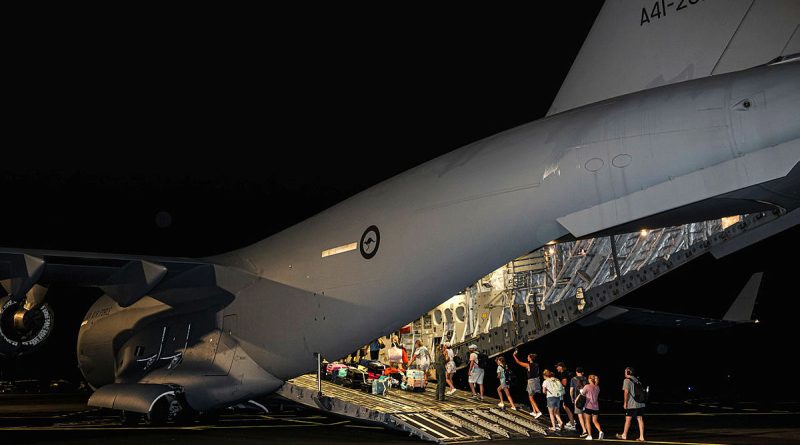 Australian citizens board a RAAF C-17A flight home at Bauerfield International Airport, Port Vila, following the Vanuatu earthquake. Photos by Corporal Adam Abela.