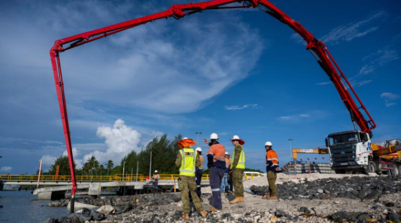 Australian Army officers Captain Will Guelen and Captain Max Cubis, of 12th Chief Engineer Works, oversee the concrete pour for the boat ramp under construction at Lombrum Naval Base, PNG. Story by Major Evita Ryan. Photos by Corporal Joshua Thomas.