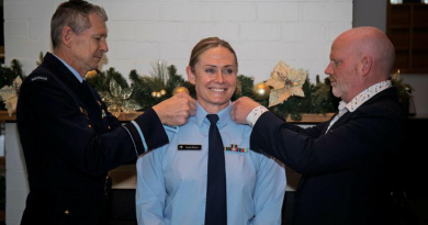 Royal New Zealand Air Force Group Captain Susie Barns is promoted to Air Commodore by Air Commander Australia Air Vice-Marshal Glen Braz, left, and her spouse Tom at her promotion and appointment to Deputy Air Commander Australia ceremony, held at the ADF Academy officers mess. Story by John Noble. Photo by Aircraftman Jakob Reid.