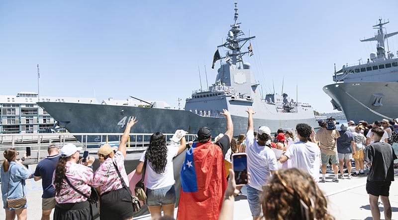 Families welcome HMAS Brisbane to its home port at Fleet Base East in Sydney, New South Wales following a successful deployment to the United States. Photo by Leading Seaman Matthew Lyall.