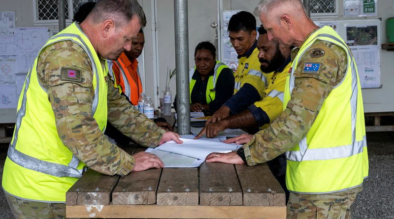 Australian Army soldiers WO2 Bryan Griff and WO2 Paul Thornhill gather with contractors from Reeves Envico and Hebou to discuss the progress of the PNGAus Partnerships’ Potable Water Infrastructure Works at the PNG Defence Force’s Goldie River Training Depot, PNG. Story by Major Evita Ryan. Photos by Corporal Joshua Thomas.