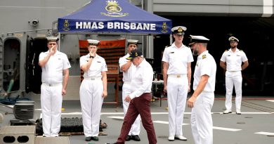 HMAS Brisbane's piping party pipes the side as Vice Admiral Donald Chalmers (retd) steps off the ship after a ship's tour alongside Fleet Base East in Sydney, NSW. Story by Sub-Lieutenant Angus Tyson. Photos by Leading Seaman Abdus Chowdhury.