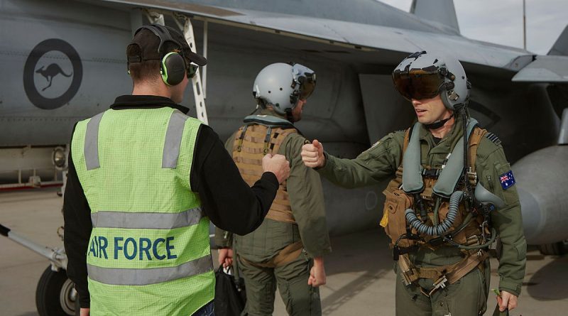 A RAAF 1 Squadron F/A-18F Super Hornet pilot, weapons systems officer and ground crew member meet for pre-flight checks during Exercise Red Flag Nellis 25-1 in Nevada, US. Story by Flying Officer Shanea Zeegers. Photos by Aircraftwoman Laura Flower.