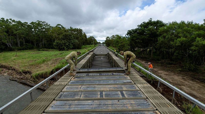 Soldiers from 3rd Combat Engineer Regiment assemble a medium girder bridge at Ollera Creek, Townsville, during Defence Assistance to the Civil Community following severe weather and flooding across the region. Story by Captain Brittany Evans. Photos by Corporal Riley Blennerhassett.