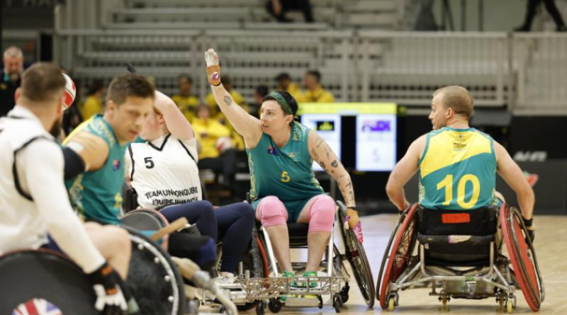 Major Liz Daly competes for the ball during the wheelchair rugby competition at Invictus Games Vancouver Whistler 2025. Story by Flying Officer Belinda Barker. Photo by WOFF Ricky Fuller.