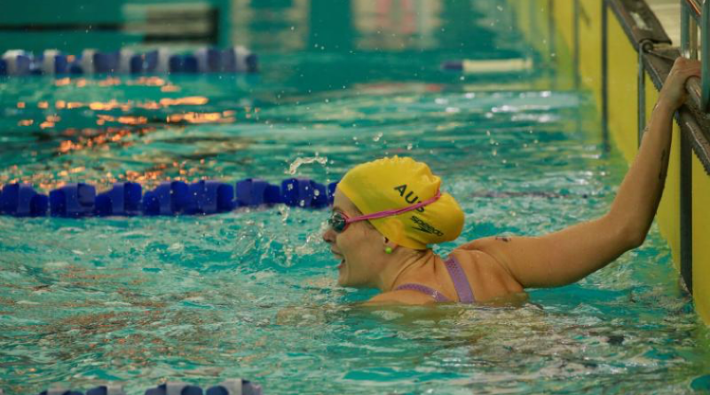 Chelsie Clayton yells her support to competitors still swimming at UBC Aquatic Centre as part of Invictus Games Vancouver Canada 2025. Story by Flying Officer Belinda Barker. Photo by Flight Sergeant Chris Dickson.