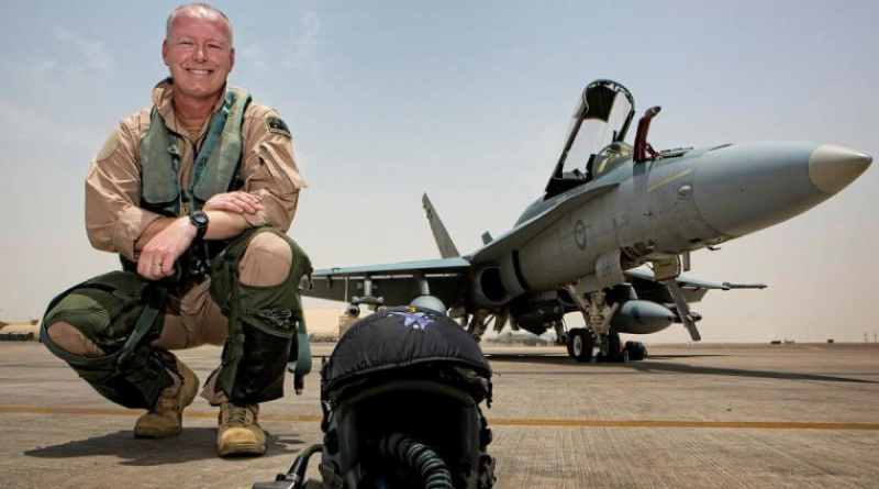 Commander Air Task Group Air Commodore Philip Gordon in front of an F/A-18A Hornet on the flight line of Australia's main air operating base in the Middle East region. This image has been digitally modified. Story by Warrant Officer Class Two Max Bree. Photos by Corporal Nicci Freeman.