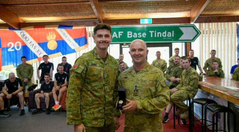 Australian Army officer Brigadier Damian Hill presents Lance Bombardier Joshua Burke with an engraved watch in recognition of the Mattner Award. Story by Major Tim Sydenham. Photo by Signals Aaron Thant.